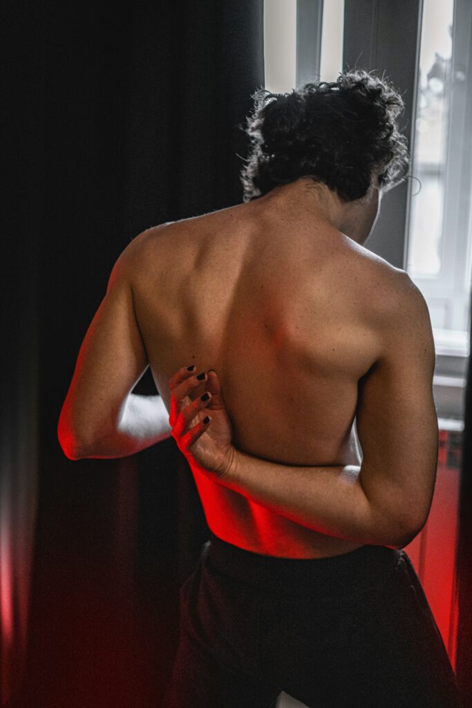 Man struggling with middle to upper back pain